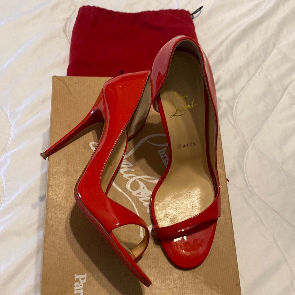 Red pattern leather Christian louboutin.  Wear them once.